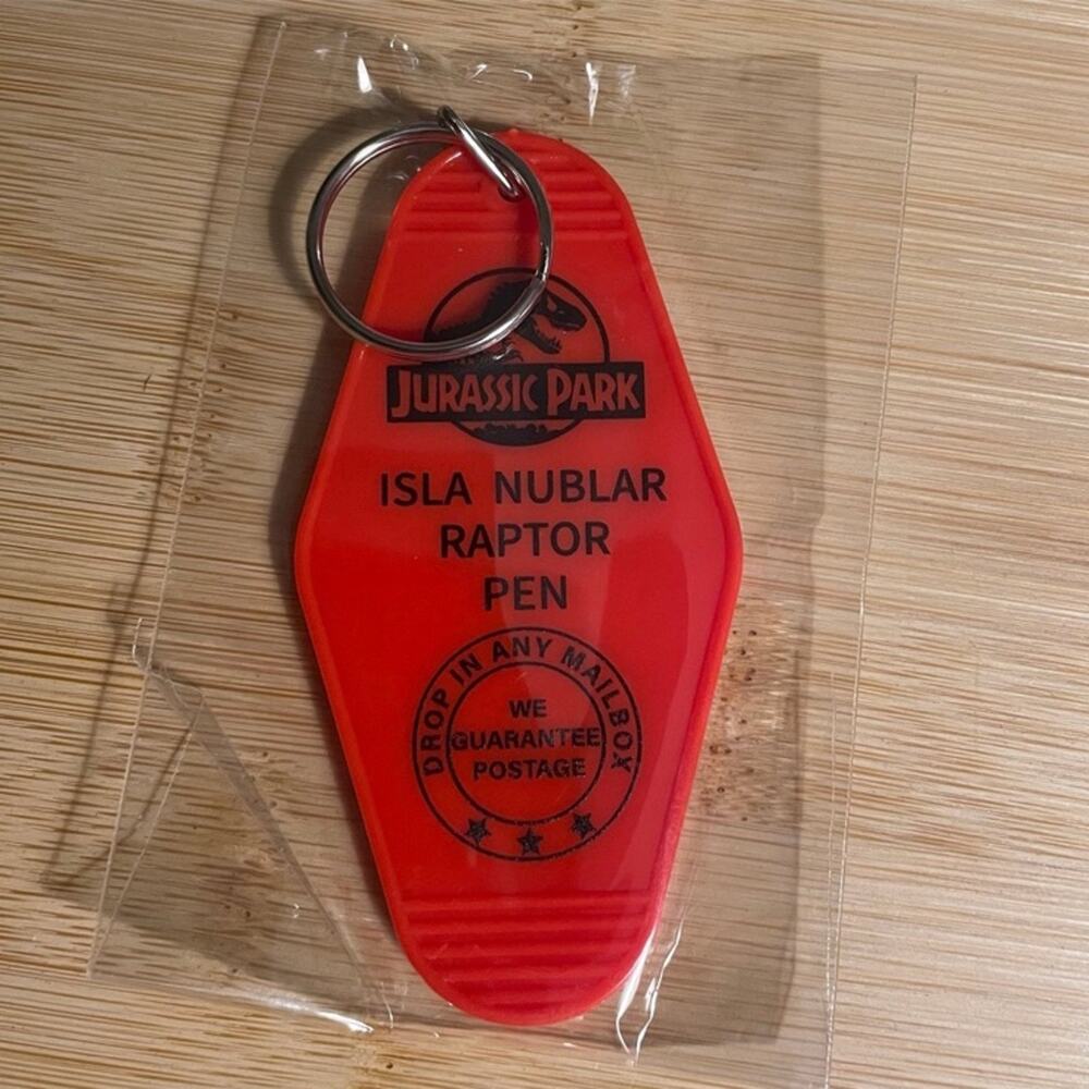 Jurassic Park Isla Nublar Raptor Pen Keychain